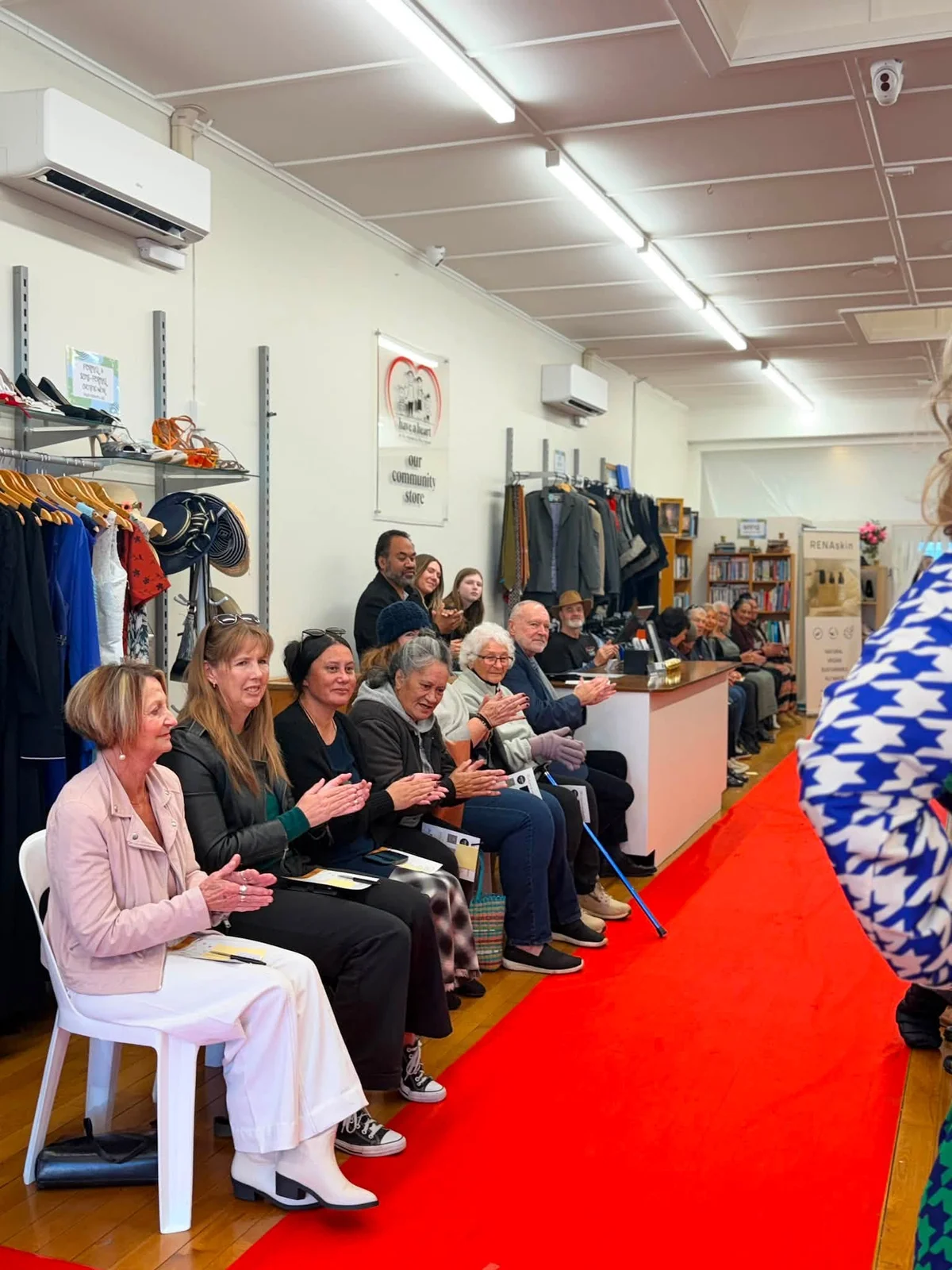 Guests seated beside the red-carpet runway